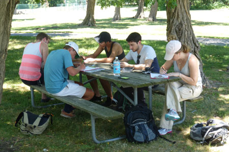 Photo: Group sitting on park bench.