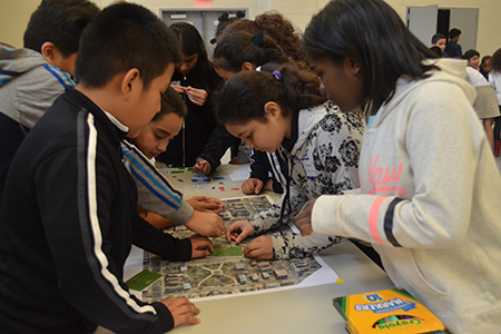 Children engaging in CUES outreach activity.