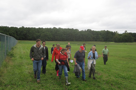 People walking on a grassy area, current projects