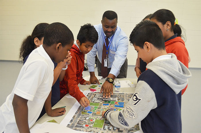 Children looking at map.