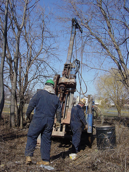 Photo: Drilling groundwater sampling wells in Kearny Marsh.