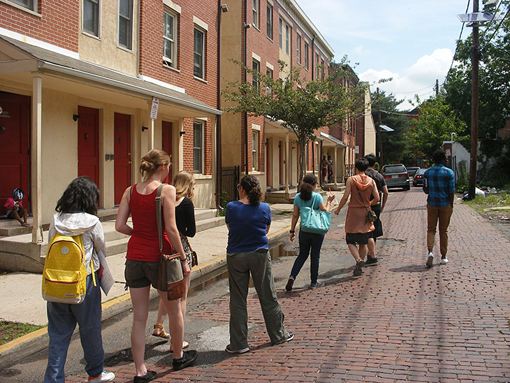 Student group walking the streets of Trenton neighborhood