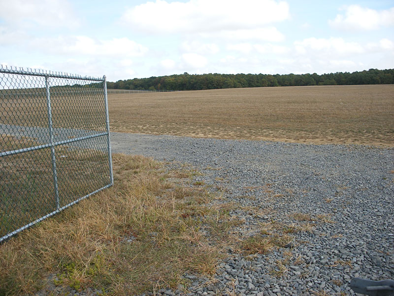 Centennial Blvd. entrance and fenced site condition prior to design completion.