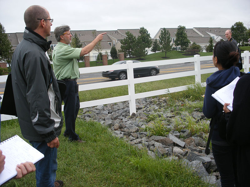 Voorhees Township engineer Joe Hale explaining the site's stormwater runoof drainage system to Rutgers Landscape Architecture graduate students.